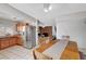 Open floor plan with kitchen, dining area and living room with brick fireplace at 671 Riata Way, Las Vegas, NV 89110