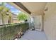 Cozy balcony with privacy hedge and sliding glass door, perfect for relaxing outdoors at 6868 Sky Pointe Dr # 1107, Las Vegas, NV 89131