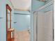 Bathroom with a walk-in shower, decorative wallpaper border and unique wooden shelving unit at 6868 Sky Pointe Dr # 1107, Las Vegas, NV 89131