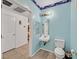 This powder blue bathroom offers unique finishes, a decorative mirror and a toilet at 6868 Sky Pointe Dr # 1107, Las Vegas, NV 89131