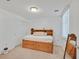 Cozy bedroom featuring a built-in headboard with storage, bright natural light, and mirrored furniture at 6868 Sky Pointe Dr # 1107, Las Vegas, NV 89131