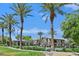 Beautiful community pool area surrounded by lush palm trees and well-maintained landscaping at 6868 Sky Pointe Dr # 1107, Las Vegas, NV 89131