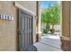 Inviting front door with security screen and desert landscaping, creating a warm welcome at 6868 Sky Pointe Dr # 1107, Las Vegas, NV 89131