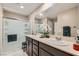 Bathroom featuring double sinks, neutral paint, and a glass door shower at 7224 Piute Mesa St, North Las Vegas, NV 89084