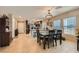 Well-lit dining area with modern chandelier adjacent to the kitchen at 7224 Piute Mesa St, North Las Vegas, NV 89084