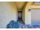 Inviting entryway with tiled floor, security door, and sitting bench at 7224 Piute Mesa St, North Las Vegas, NV 89084