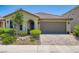Charming single-story home features a tile roof and a well-maintained front yard at 7224 Piute Mesa St, North Las Vegas, NV 89084