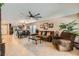 Spacious living room with an open layout, tile floors, ceiling fan, and dining area at 7224 Piute Mesa St, North Las Vegas, NV 89084
