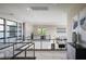 Bright hallway with modern railings, large windows, and stylish decor at 80 Glade Hollow Dr, Las Vegas, NV 89135