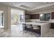 Modern kitchen featuring a large island, stainless steel appliances, and open living space at 80 Glade Hollow Dr, Las Vegas, NV 89135