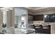 Bright kitchen overlooking the dining area, featuring a large island and modern appliances at 80 Glade Hollow Dr, Las Vegas, NV 89135