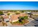 Captivating aerial view showcasing a beautiful home, desert landscape, and a glimpse of the city skyline at 8650 W Verde Way, Las Vegas, NV 89149