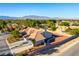 Stunning aerial view of a luxurious home showcasing a private backyard, desert landscape, and mountain views at 8650 W Verde Way, Las Vegas, NV 89149