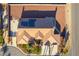 Birds eye view showcasing a well-manicured property in a residential area with a view of the city skyline at 8650 W Verde Way, Las Vegas, NV 89149