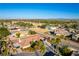 Desirable real estate featuring well-kept desert landscaping and a view of the city skyline in the distance at 8650 W Verde Way, Las Vegas, NV 89149