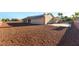 Wide view of a home with solar panels and a desert landscaped backyard at 8650 W Verde Way, Las Vegas, NV 89149