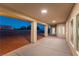 Spacious covered patio with recessed lighting and a concrete floor, perfect for outdoor living and entertaining at 8650 W Verde Way, Las Vegas, NV 89149