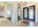 Elegant entryway boasts tile flooring, decorative doors, and arched openings leading to other rooms at 8650 W Verde Way, Las Vegas, NV 89149