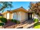 Inviting home exterior with a well-manicured lawn, charming landscaping, and a welcoming entrance at 8650 W Verde Way, Las Vegas, NV 89149