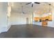 Spacious living area with a fireplace, hardwood floors, and a view into the kitchen at 8650 W Verde Way, Las Vegas, NV 89149