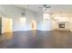 Living room features a ceiling fan, wood-look flooring, and a fireplace at 8650 W Verde Way, Las Vegas, NV 89149