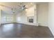 Open living room features high ceilings, hardwood floors, fireplace, and plenty of natural light at 8650 W Verde Way, Las Vegas, NV 89149