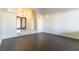 Open living room with hardwood floors, and an entryway with decorative glass doors at 8650 W Verde Way, Las Vegas, NV 89149
