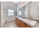 Bright bathroom featuring double sinks, granite countertops and a shower and tub combo at 8805 Jeffreys St # 1048, Las Vegas, NV 89123