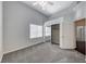 This bedroom boasts ample natural light, a ceiling fan, and mirrored closet doors at 8805 Jeffreys St # 1048, Las Vegas, NV 89123
