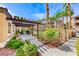 Shaded walkway features stone benches and beautiful views of the community pool at 8805 Jeffreys St # 1048, Las Vegas, NV 89123