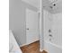 Bright bathroom featuring a shower and wood-look flooring at 9024 Hazy Haven Ct, Las Vegas, NV 89149