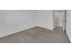 This bedroom features neutral carpet, white walls, and a large closet with sliding doors at 9024 Hazy Haven Ct, Las Vegas, NV 89149