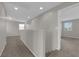 Light-filled hallway showcases neutral paint and carpet, recessed lighting, and access to multiple rooms at 9024 Hazy Haven Ct, Las Vegas, NV 89149