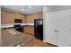 Well-equipped kitchen with stainless steel appliances and wood cabinets at 9024 Hazy Haven Ct, Las Vegas, NV 89149