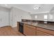 Kitchen with stainless steel appliances, wood cabinets and a breakfast bar at 9024 Hazy Haven Ct, Las Vegas, NV 89149