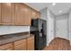 Kitchen with stainless steel refrigerator and wood cabinets at 9024 Hazy Haven Ct, Las Vegas, NV 89149