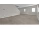 Spacious living room with carpet, neutral walls, and plenty of natural light at 9024 Hazy Haven Ct, Las Vegas, NV 89149