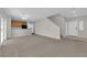 Spacious open-plan living area with modern finishes and stairs at 9024 Hazy Haven Ct, Las Vegas, NV 89149