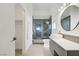 Modern bathroom featuring a frameless glass shower and vessel sink at 925 Mandolin Way, North Las Vegas, NV 89032