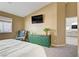 Comfortable bedroom with green cabinet and television at 925 Mandolin Way, North Las Vegas, NV 89032