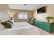 Comfortable bedroom with green cabinet and television at 925 Mandolin Way, North Las Vegas, NV 89032