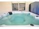 Inviting hot tub with crystal-clear water, perfect for relaxation and entertainment in your private outdoor space at 925 Mandolin Way, North Las Vegas, NV 89032