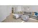 Bright living room with a large sectional sofa, hardwood floors, and modern decor at 925 Mandolin Way, North Las Vegas, NV 89032