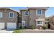 Charming townhome featuring a two-car garage and well-manicured front yard, perfect for comfortable living at 9270 Apache Springs Dr, Las Vegas, NV 89117