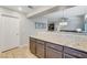 Kitchen area with granite counters and view into the living room with sofa at 9270 Apache Springs Dr, Las Vegas, NV 89117