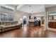 Open-concept living space showcases hardwood floors, a dining area, a living area, and a modern kitchen at 9270 Apache Springs Dr, Las Vegas, NV 89117