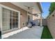 Exterior patio with a ceiling fan, seating and synthetic grass at 9270 Apache Springs Dr, Las Vegas, NV 89117