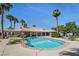 Community pool area offering ample seating, landscaping, and clear blue water at 9270 Apache Springs Dr, Las Vegas, NV 89117