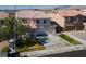 Charming two-story home with a well-manicured lawn, mature tree, and three-car garage at 9709 Casper Peak Ct, Las Vegas, NV 89117