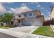 Charming two-story home with a three-car garage and desert-friendly landscaping at 9709 Casper Peak Ct, Las Vegas, NV 89117